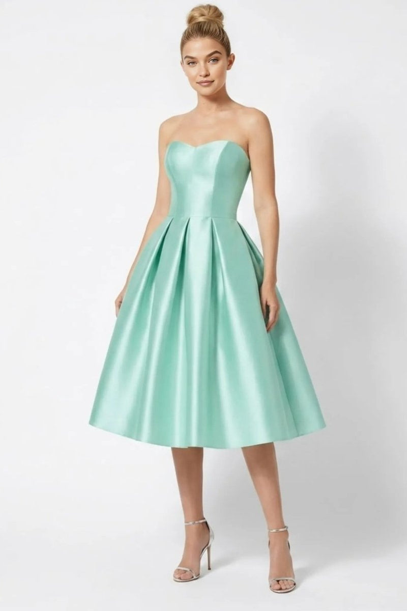 Front view of model wearing Fenlo Form mint green satin strapless sweetheart A-line midi cocktail dress