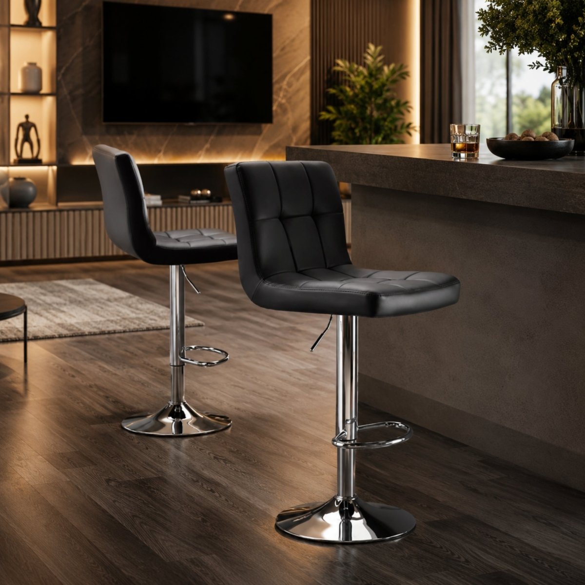 Two black modern adjustable swivel bar stools with tufted PU leather and chrome bases situated at a luxury dark wood kitchen island.