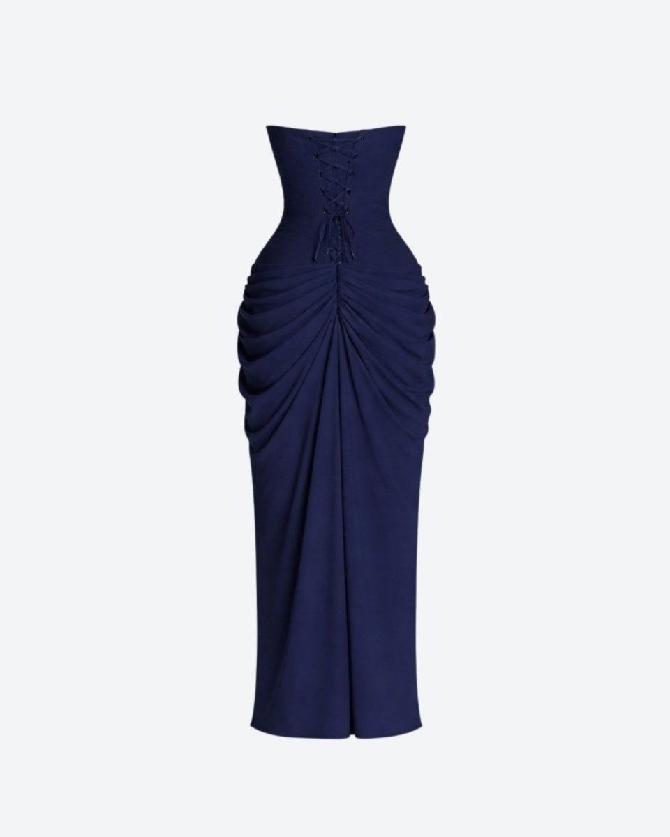 Navy blue strapless gown with ruched design on a light gray background