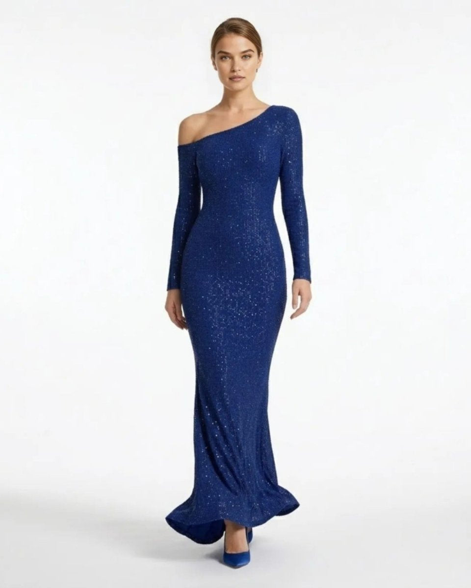 Front view of female model wearing a fitted navy blue sequin one-shoulder long sleeve maxi dress by Fenlo.