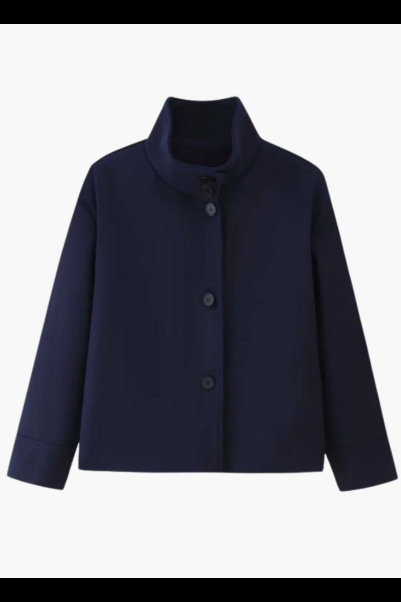 Flat lay product shot of navy single breasted button up cropped jacket with high collar.