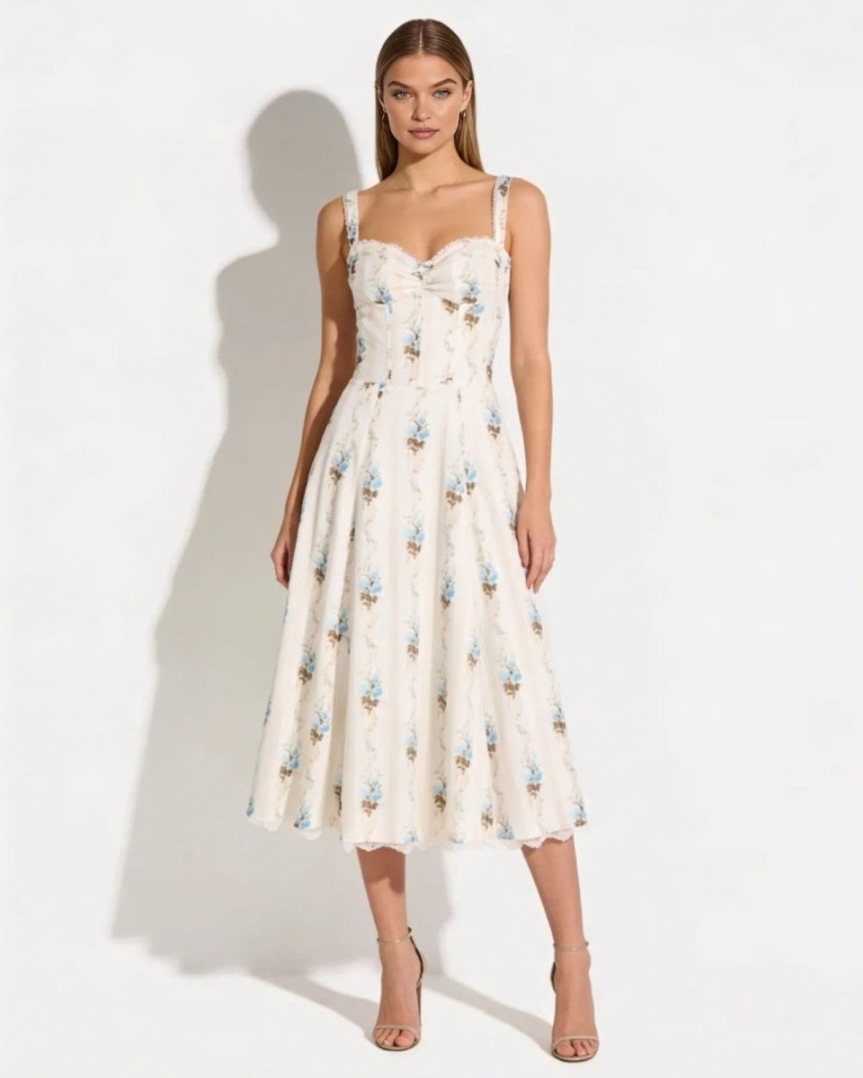 Model wearing the Nefeli cream floral corset midi dress with a sweetheart neckline and A-line skirt, shown from the front against a white background.
