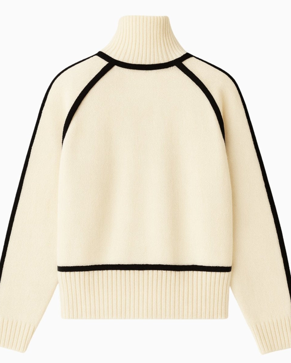 Flat lay of the back of the white and black trim sweater, showing the full detail of the luxury knit construction.