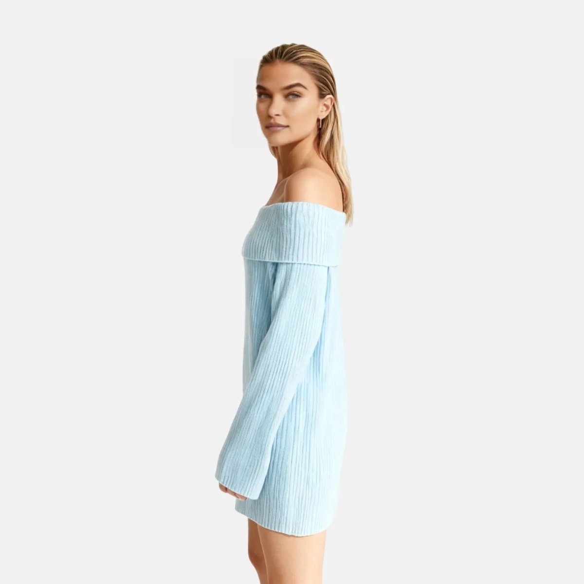 Woman wearing a light blue off-shoulder dress against a white background