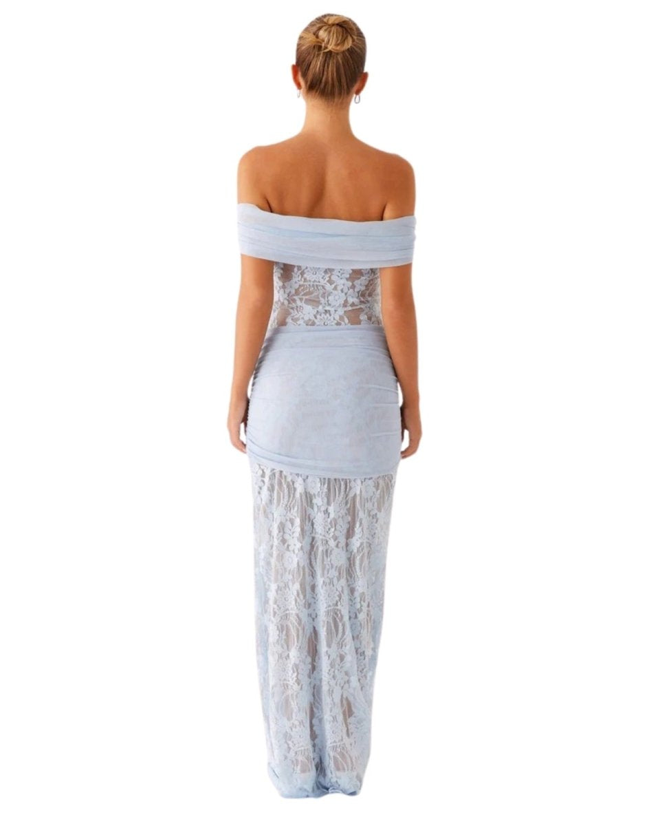 Woman wearing a light blue Fenlo off-shoulder dress with lace detailing on a white background