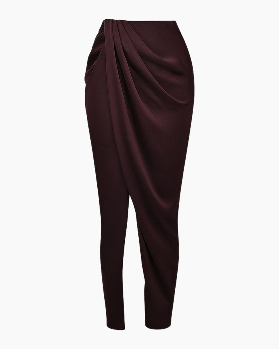 Product-only photo of the Ourania draped sarong pant in aubergine, displaying the sculptural front wrap design.