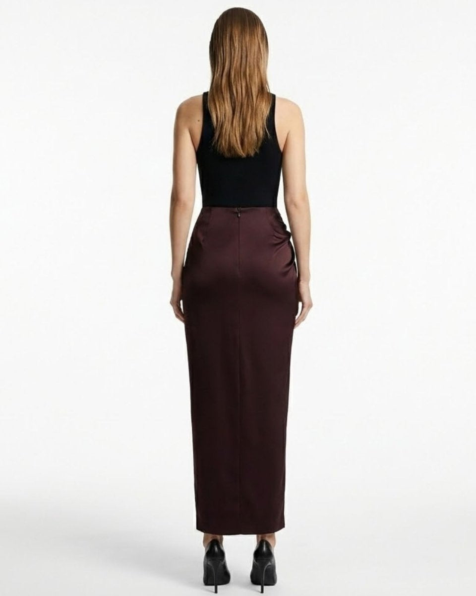 Back view of the Ourania high-waist satin trousers showcasing the smooth, tailored fit from behind.