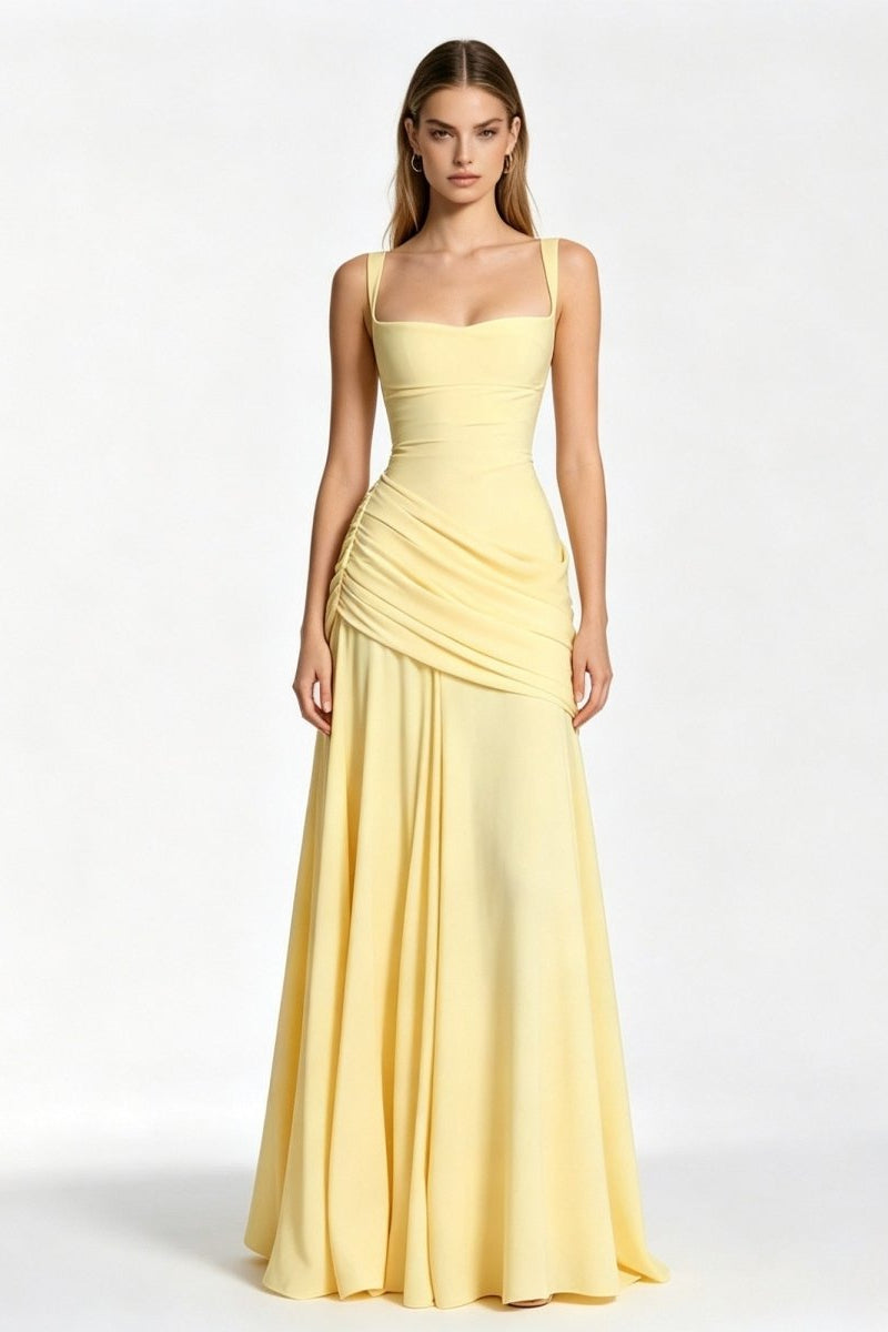Woman modeling a pale yellow square neck formal evening gown with ruched waist by Fenloform, standing facing forward against a white studio background.