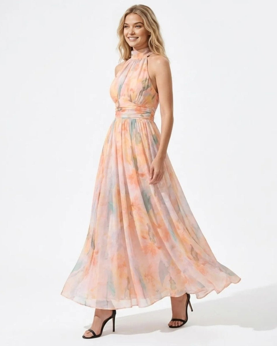 Side angle view of the flowing pastel watercolor chiffon maxi dress with ruched waist detail.