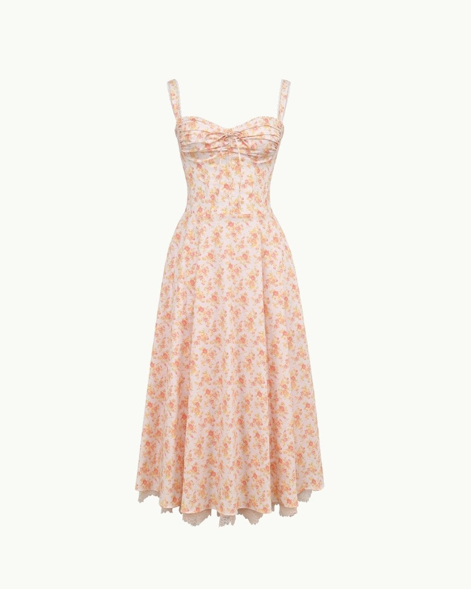 Close-up detail of the sweetheart neckline, tie-front feature, and jacquard fabric of the yellow rose floral midi dress.