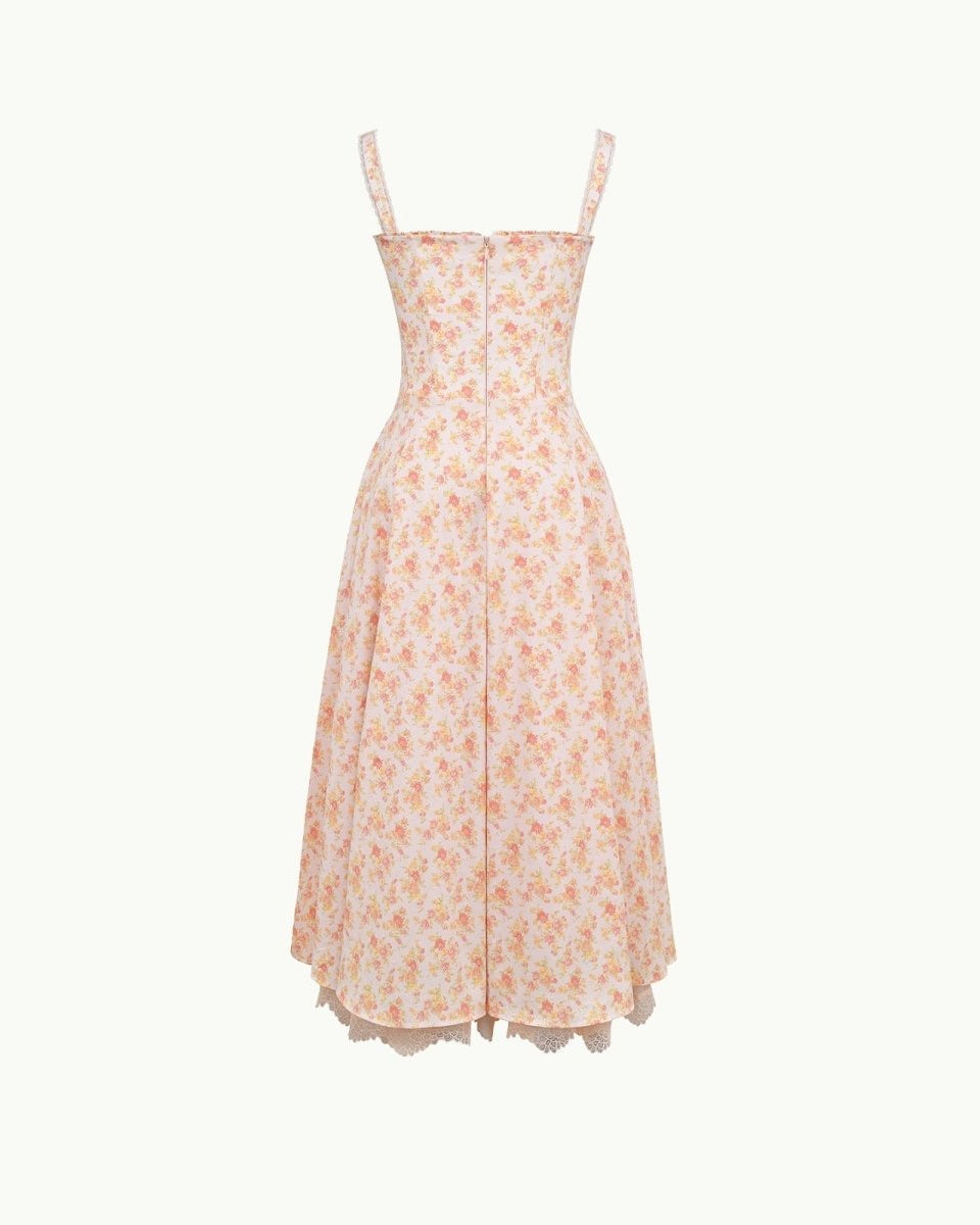 Close-up detail of the sweetheart neckline, tie-front feature, and jacquard fabric of the yellow rose floral midi dress.