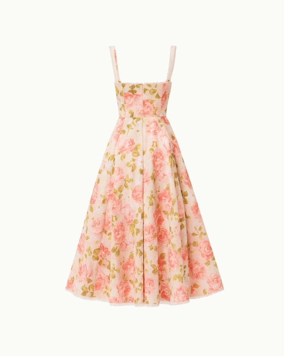 Close-up detail of the sweetheart neckline, tie-front feature, and jacquard fabric of the yellow rose floral midi dress.
