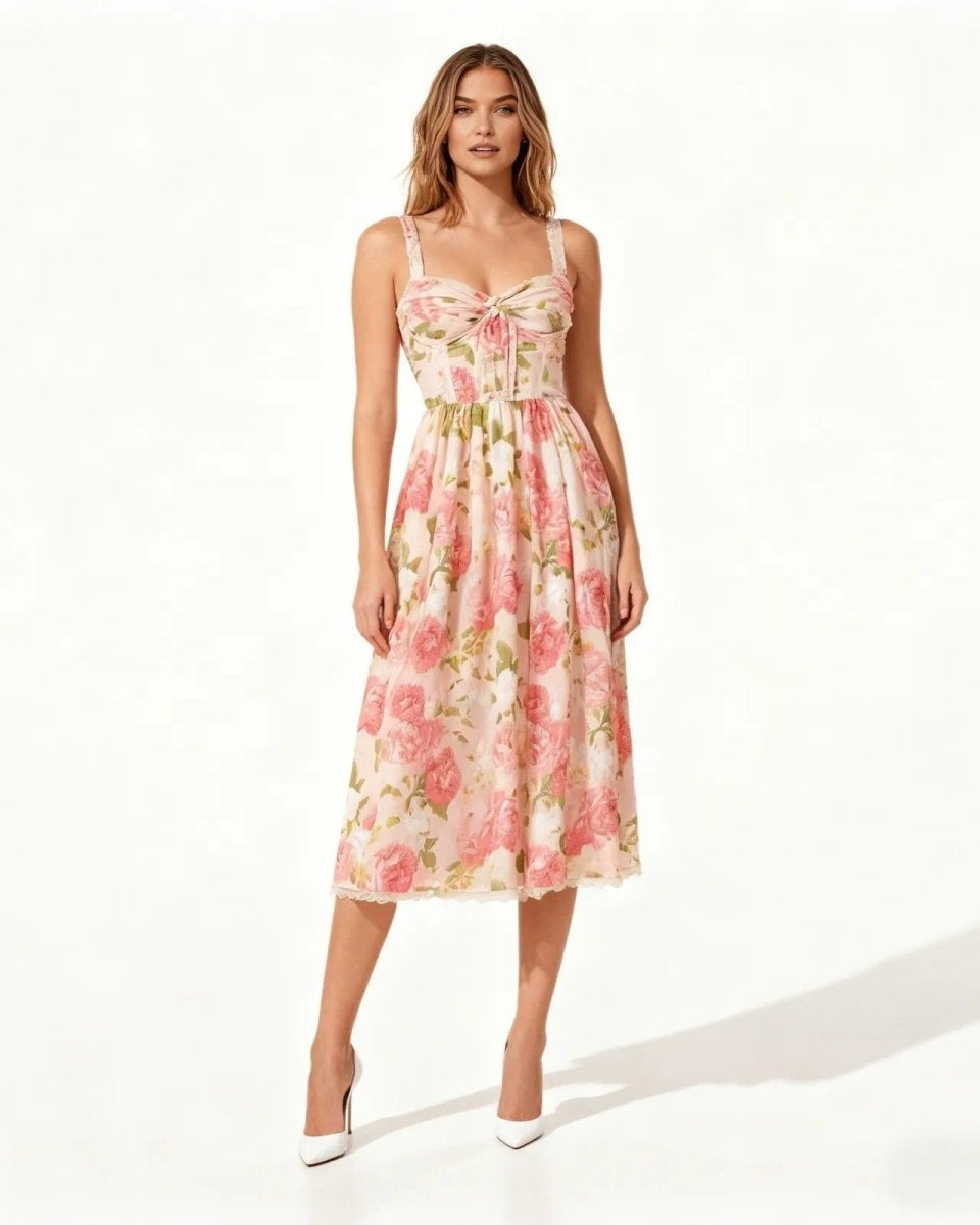 Model wearing the pink midi dress with sweetheart neckline, shown from the front against a white background.