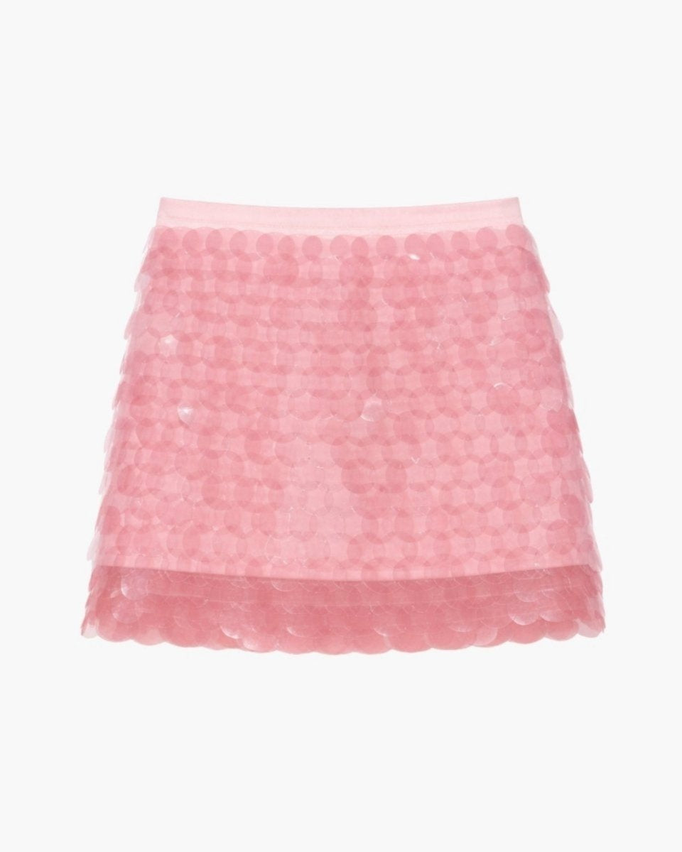 Back flat lay product shot of a pink sequin party skirt highlighting the translucent layered mesh hem and reflective disc details.