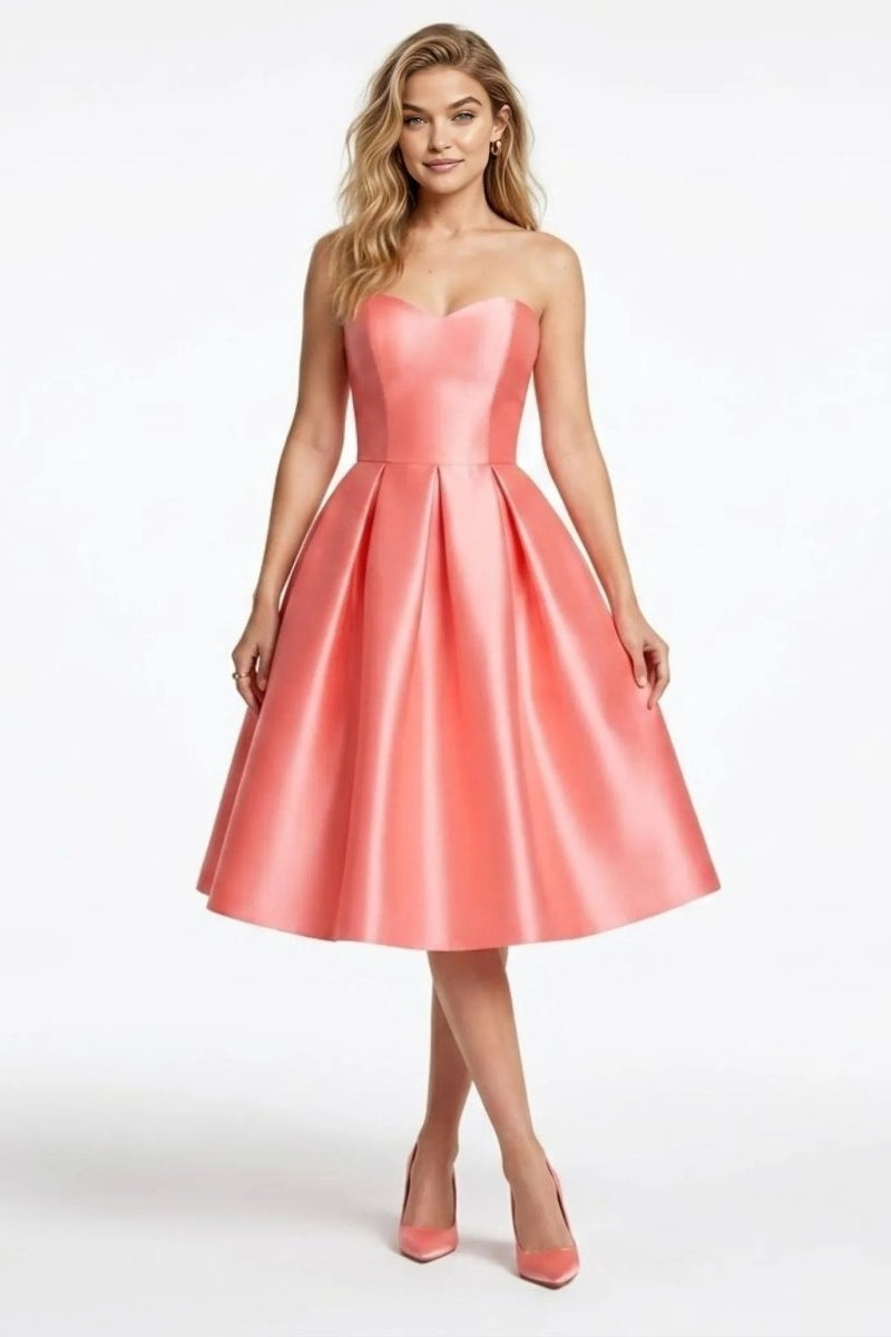 Front view of the Fenlo Form Strapless Sweetheart Satin Midi Dress in Pink worn by a blonde model.