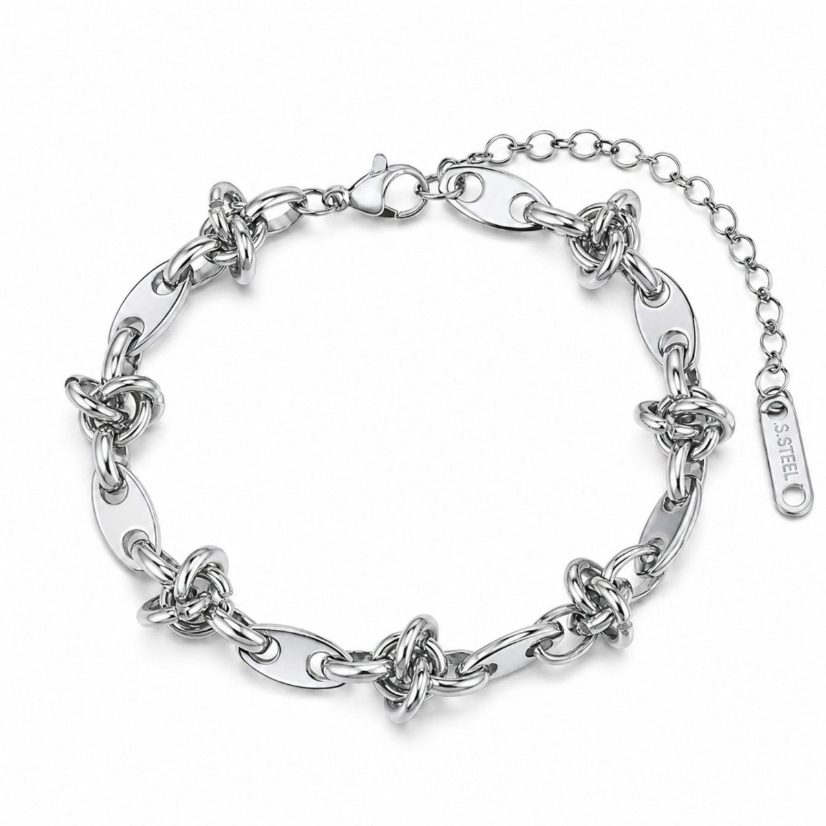 Polished silver stainless steel chunky interlocking knot link bracelet resting elegantly on a luxurious marble and silk surface.