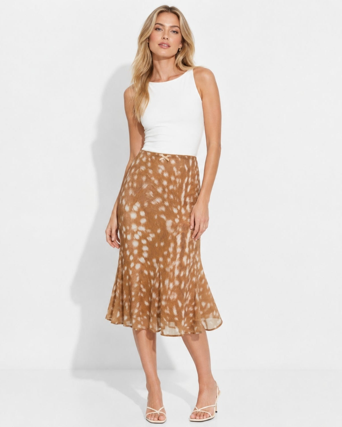 Front view of light brown fawn animal print sheer trumpet midi skirt for women