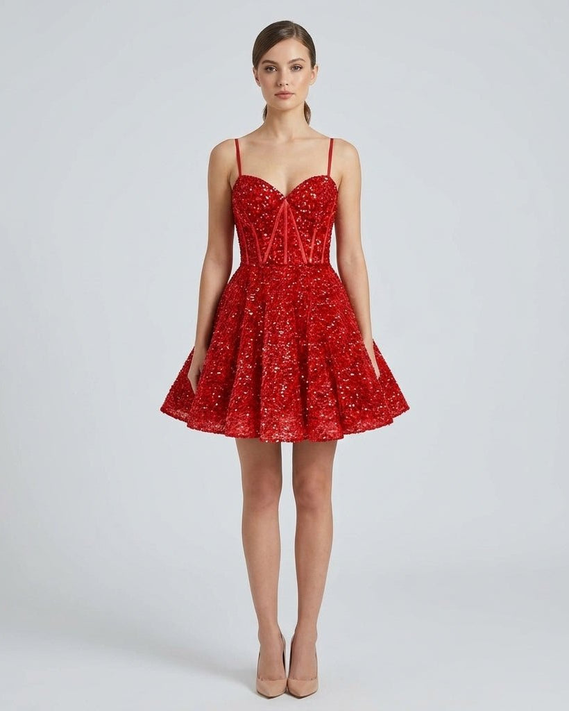 Woman wearing a sparkly red sequin corset mini dress with sweetheart neckline and flared skirt