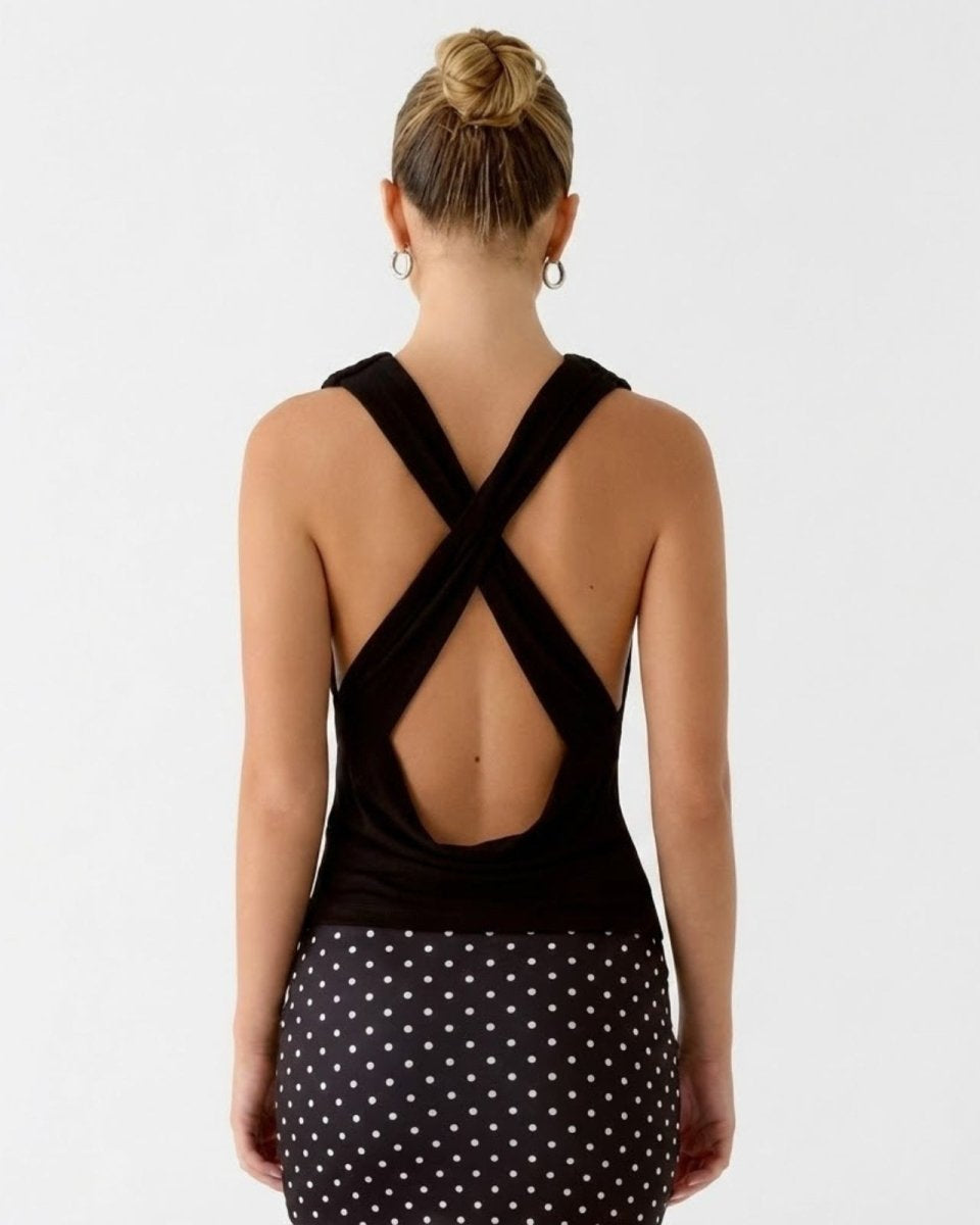 Full back view of the Rhea black jersey top, detailing the open back with wide criss-cross straps.