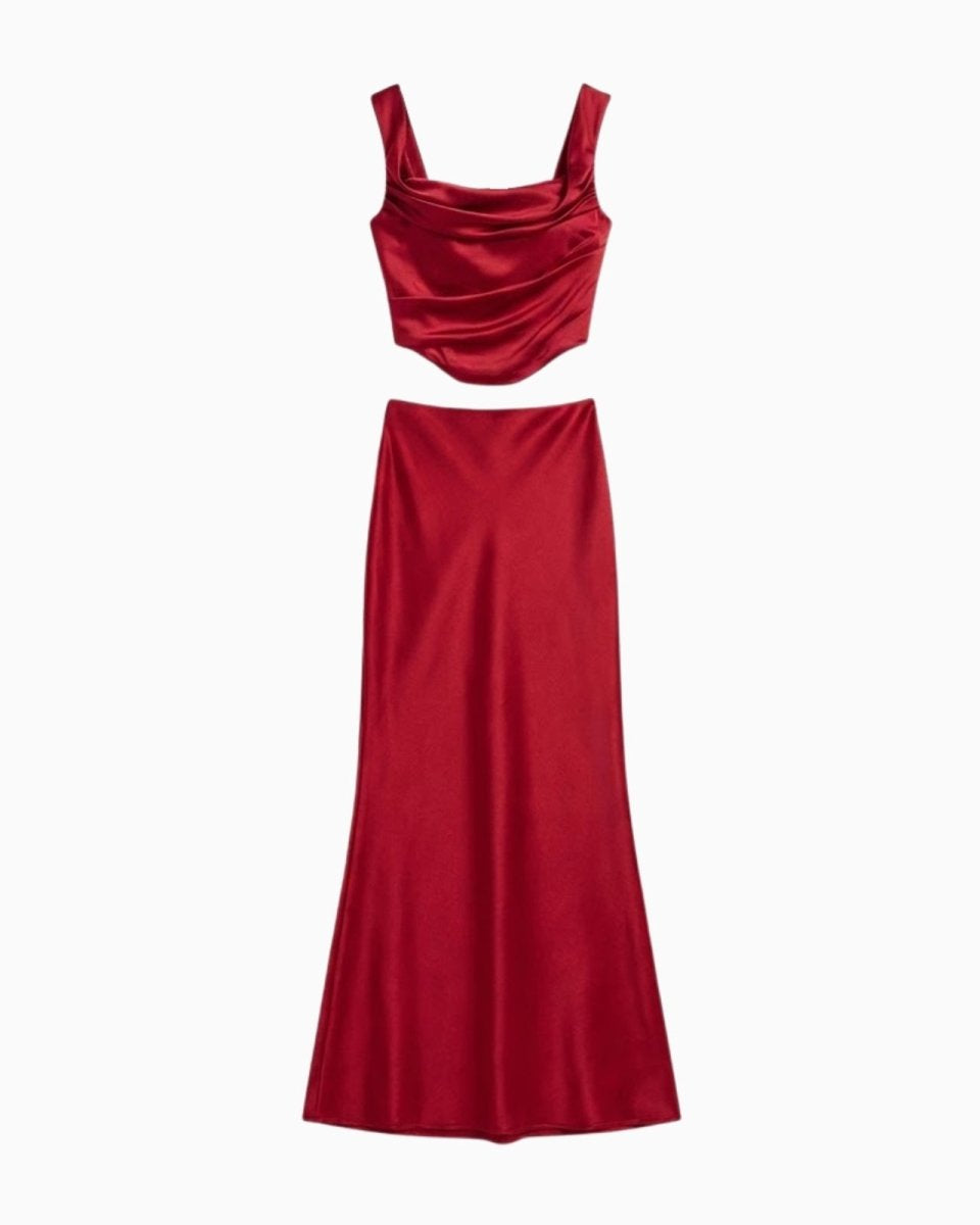 Flat lay of the Rona set in red satin, showing the front of the draped cowl neck top and long skirt.