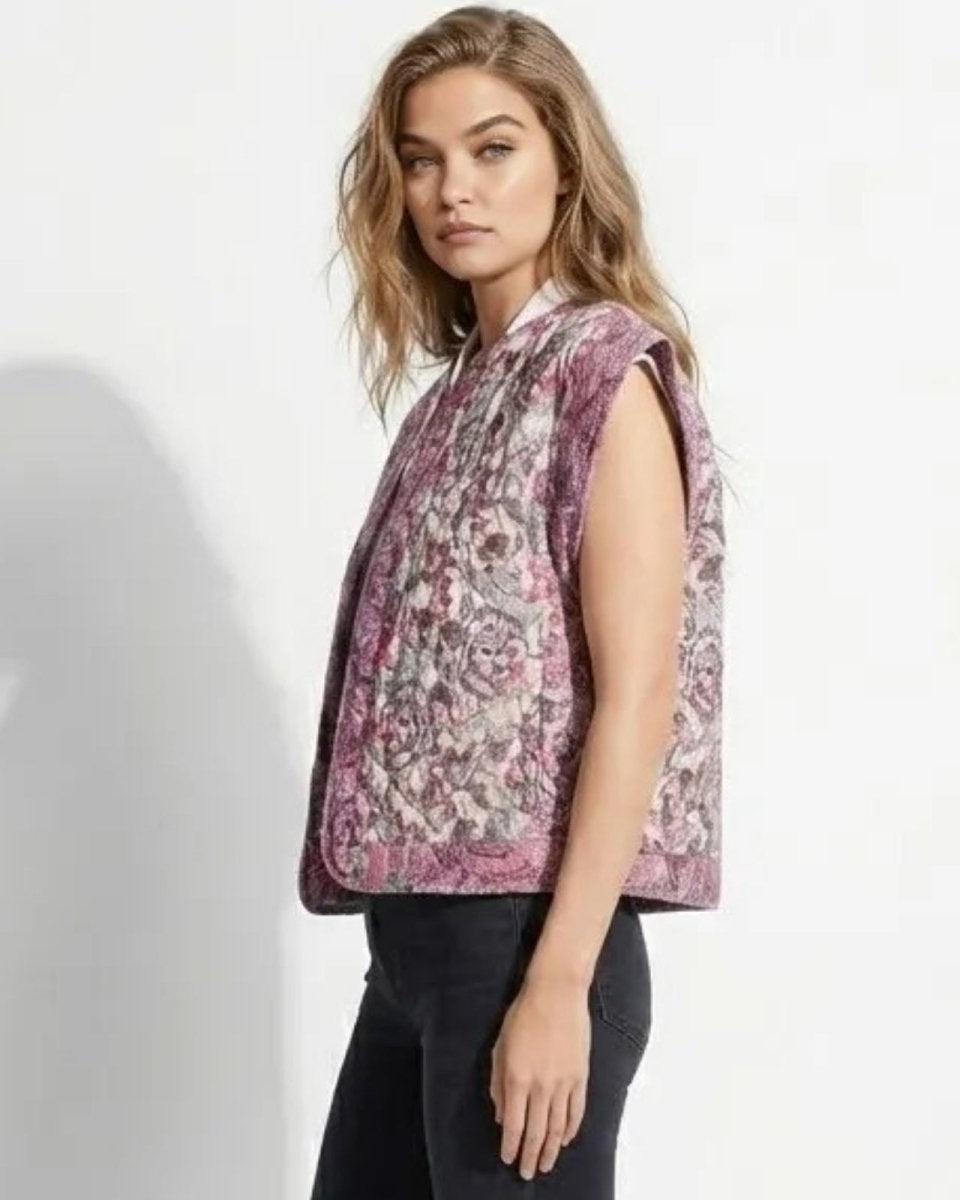 Side view of a model in the cap sleeve quilted vest, showcasing the flattering silhouette and intricate jacquard pattern.
