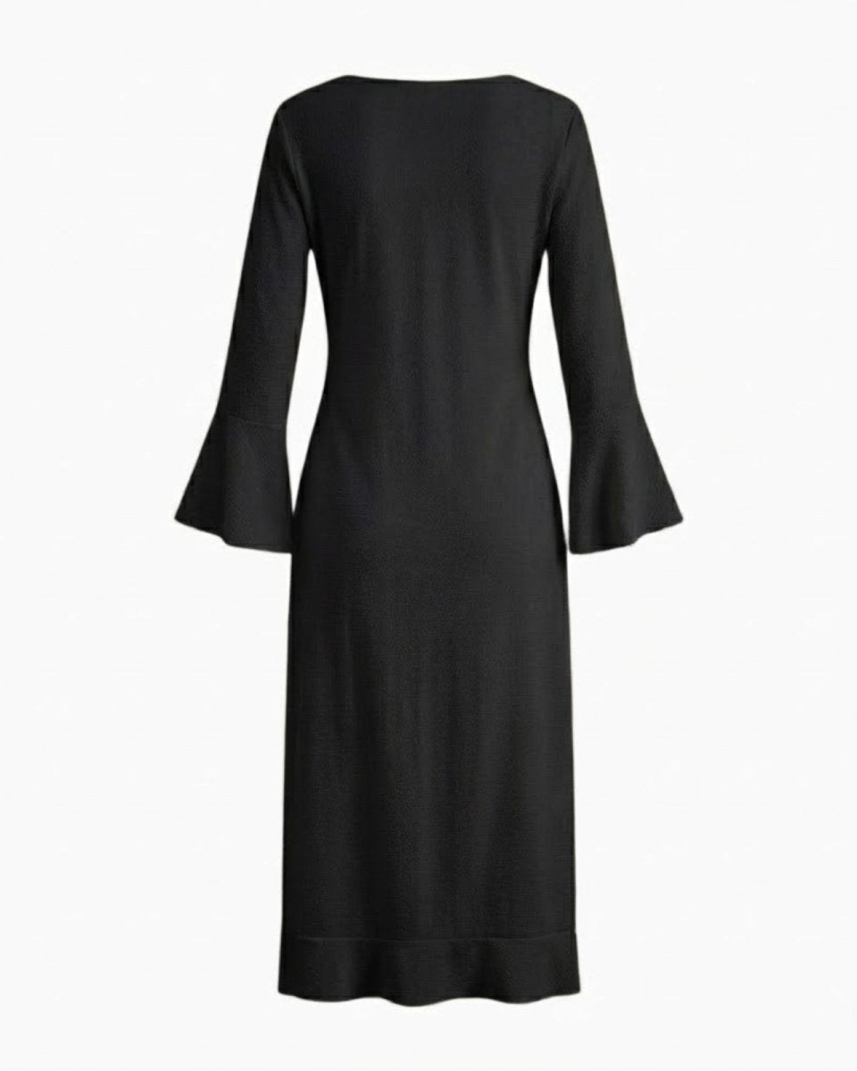 Flat lay of the back of the black Roseta maxi robe, showing the simple construction and flared sleeves.