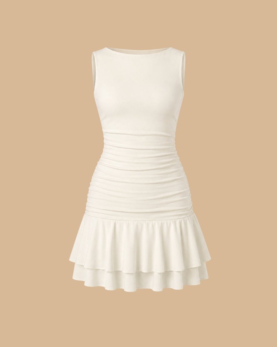 An off-white sleeveless mini dress with a crew neck, ruched waist, and a tiered ruffled hem, shown against a solid beige background.