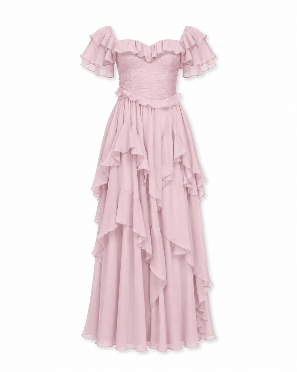 A light pink off-the-shoulder maxi dress with a ruffled bodice and layered, cascading ruffle skirt, shown against a plain white background.