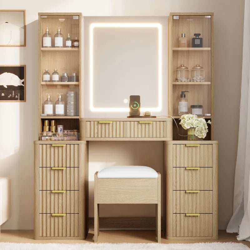 Complete oak finish makeup vanity set with a matching white leather stool and integrated LED mirror in a modern bedroom setting.
