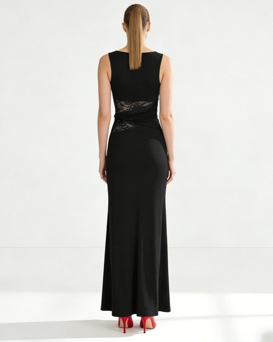 Back view of the sleeveless black formal dress, showing the clean lines, high back, and concealed zipper detail.