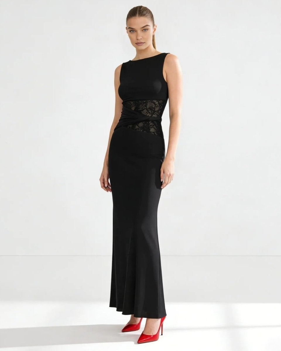 Model wearing the sleeveless black midi dress, showcasing the asymmetrical sculpted waist detail and elegant bodycon silhouette against a white background.