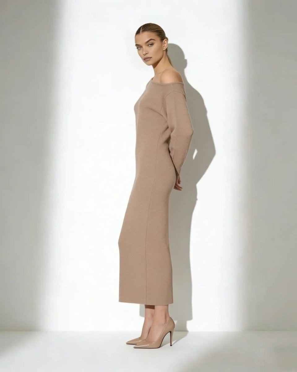 Model wearing the Selena one-shoulder long sleeve knit midi dress in camel, side profile view.