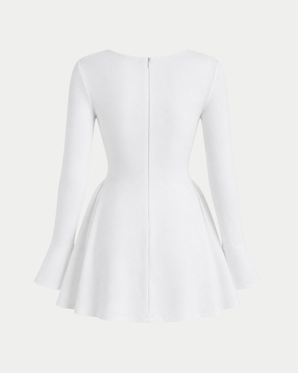 White long-sleeve dress shown from the back, featuring a fitted bodice, flared skirt, and a central zipper, set against a solid off-white background.