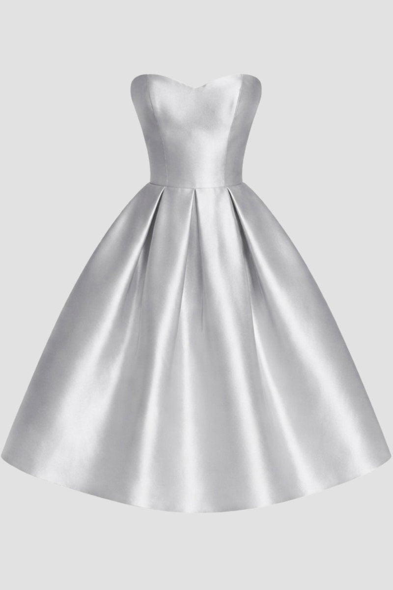 Studio ghost mannequin front view of a structured silver sweetheart neck pleated midi dress.