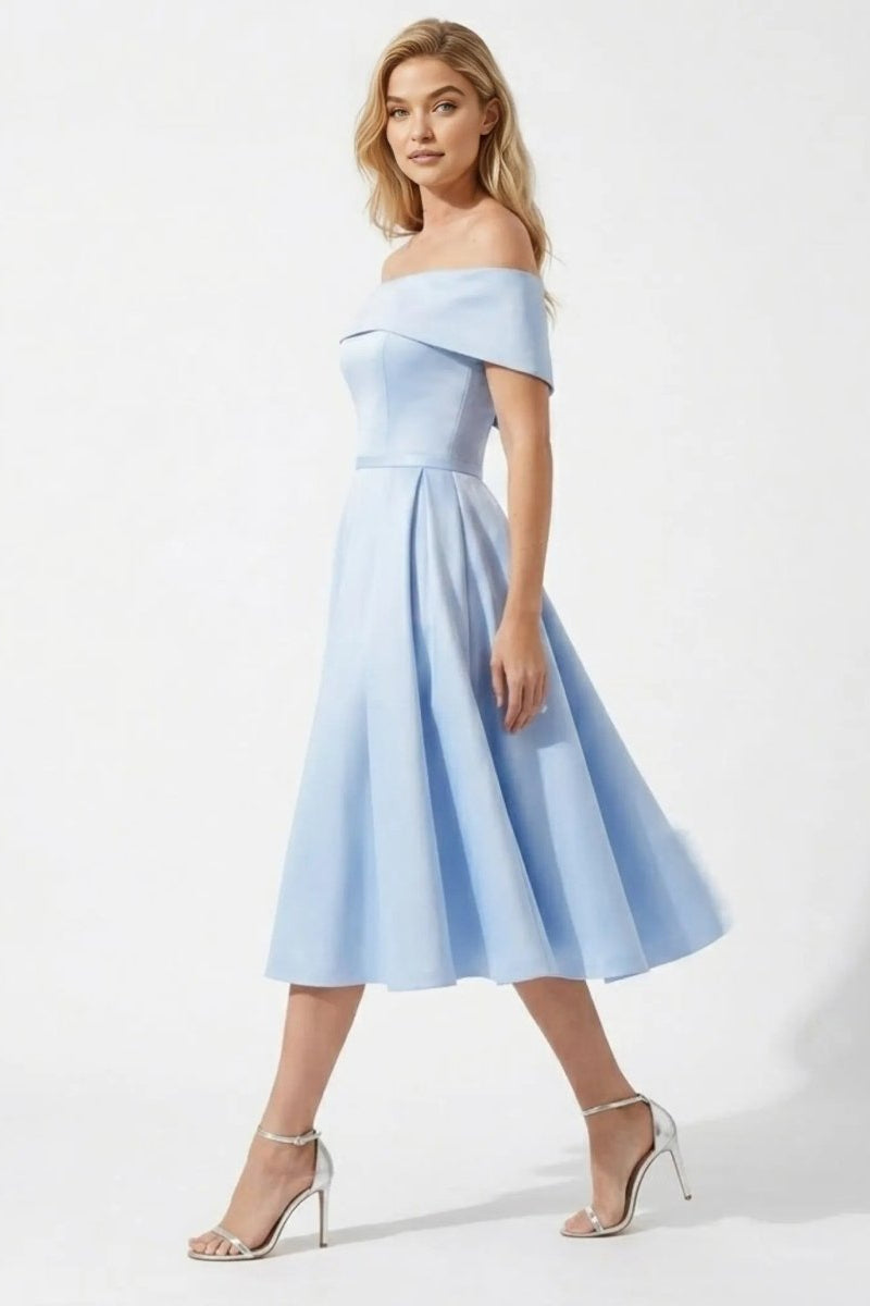 Side profile view of Fenlo Form sky blue satin off the shoulder wedding guest dress showing flared pleated skirt