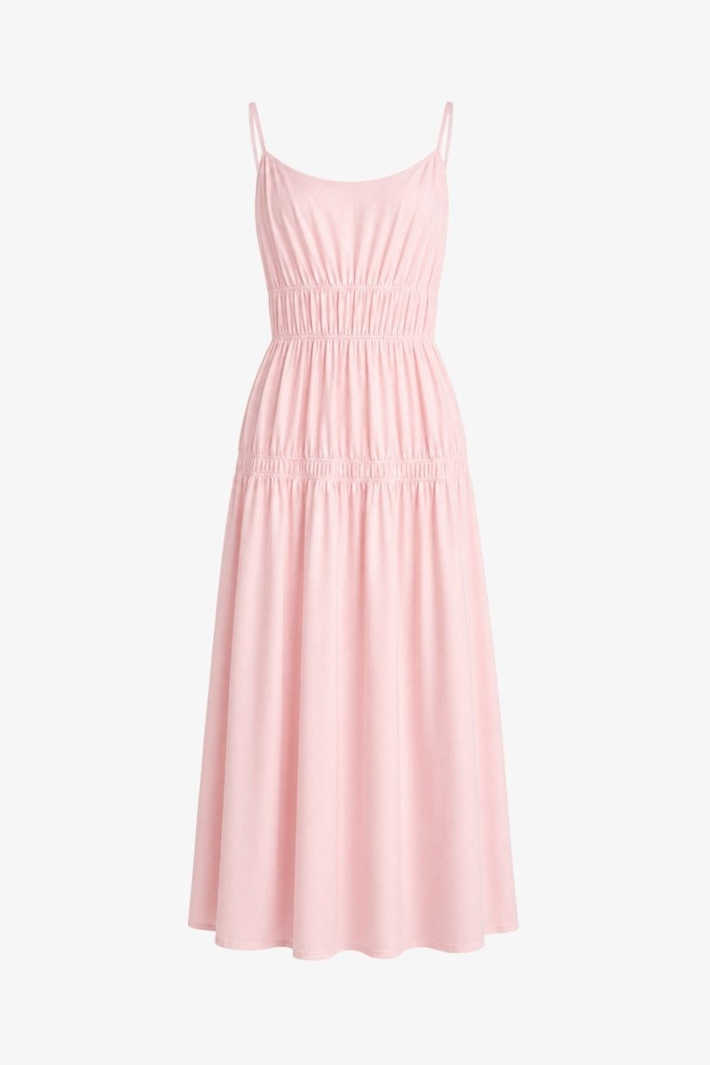 Flat lay front view of light pink smocked waist luxury resort dress