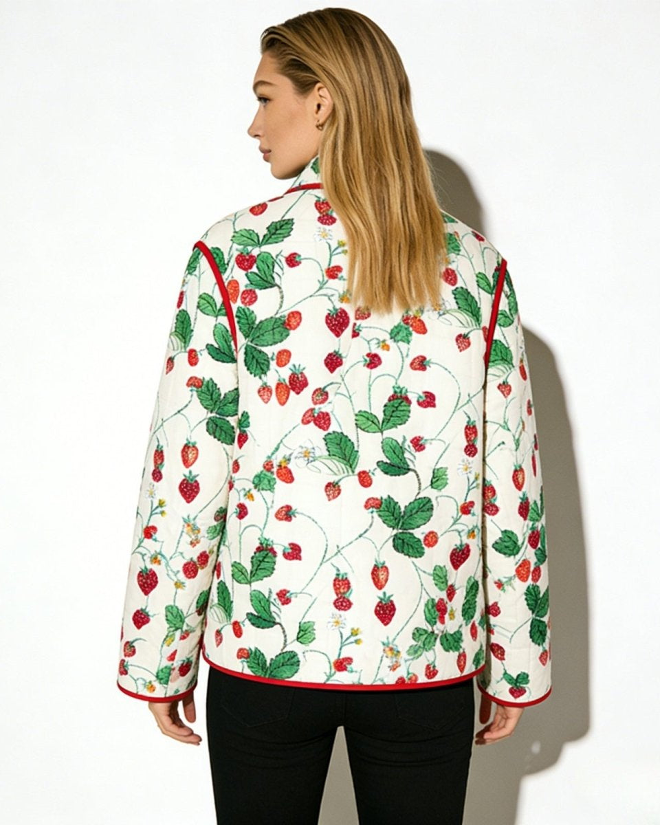 Back view of the strawberry garden quilted jacket, displaying the continuous botanical print and silhouette.