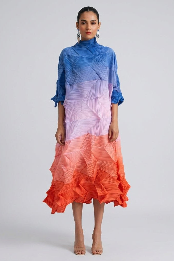 Front view of the Kouvr sunset ombre color block pleated midi dress featuring a high neck and architectural plisse texture.