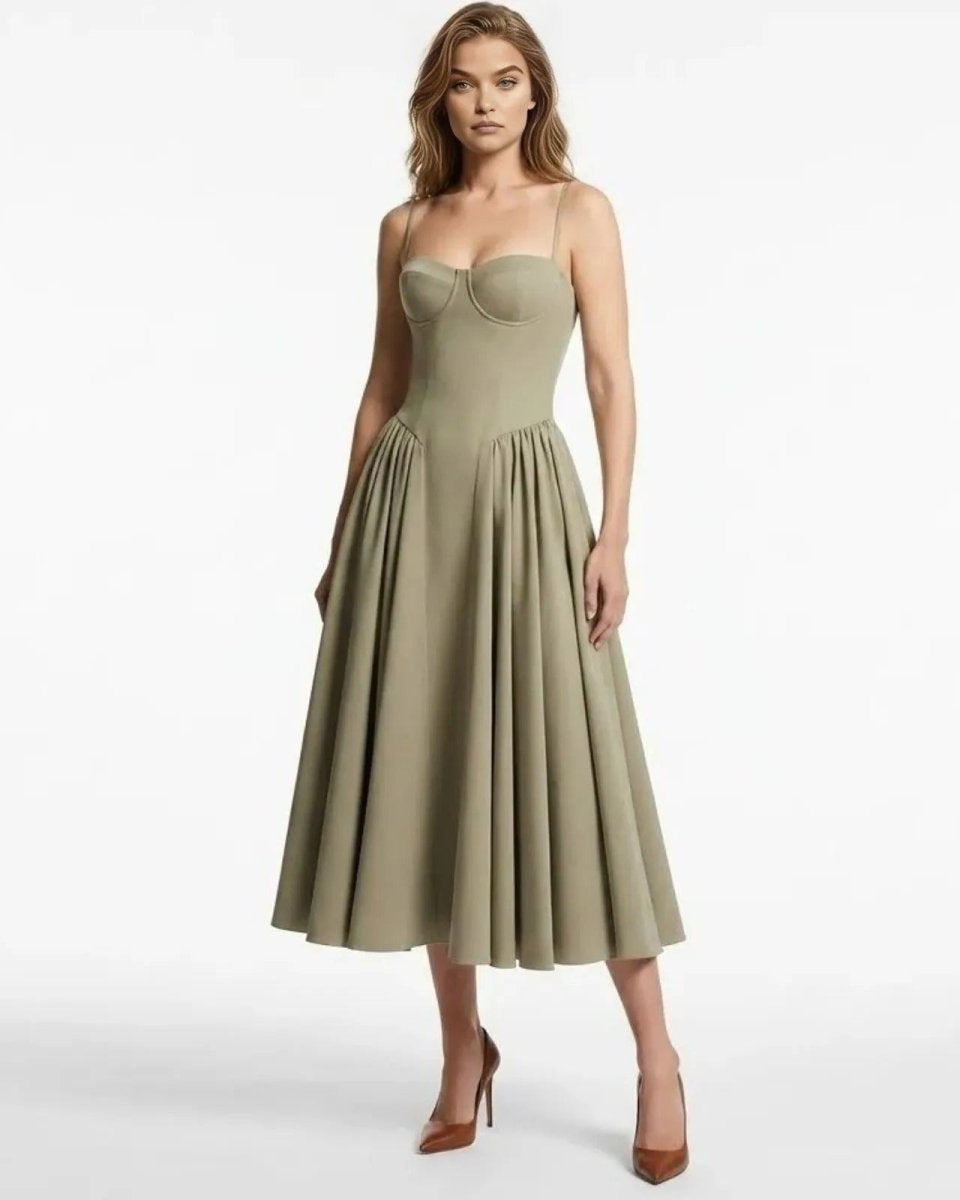Model wearing the taupe corset bustier midi dress with a pleated A-line skirt, shown from the front.