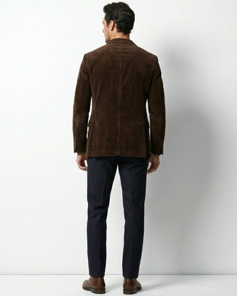 Rear view of the men's brown corduroy blazer showing the fit and double vent detail.