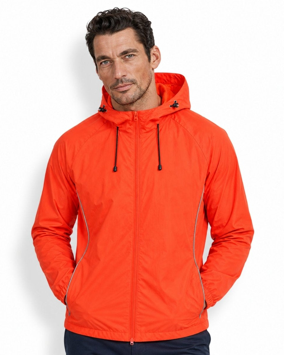 Handsome male model wearing bright orange water-resistant zip-up activewear jacket showing unisex fit and styling.