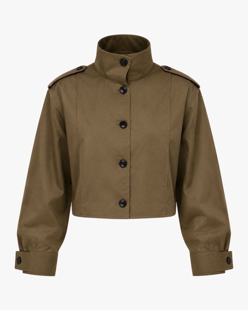 Studio shot front view of green women's cropped utility jacket highlighting the architectural high collar and contrasting hardware.