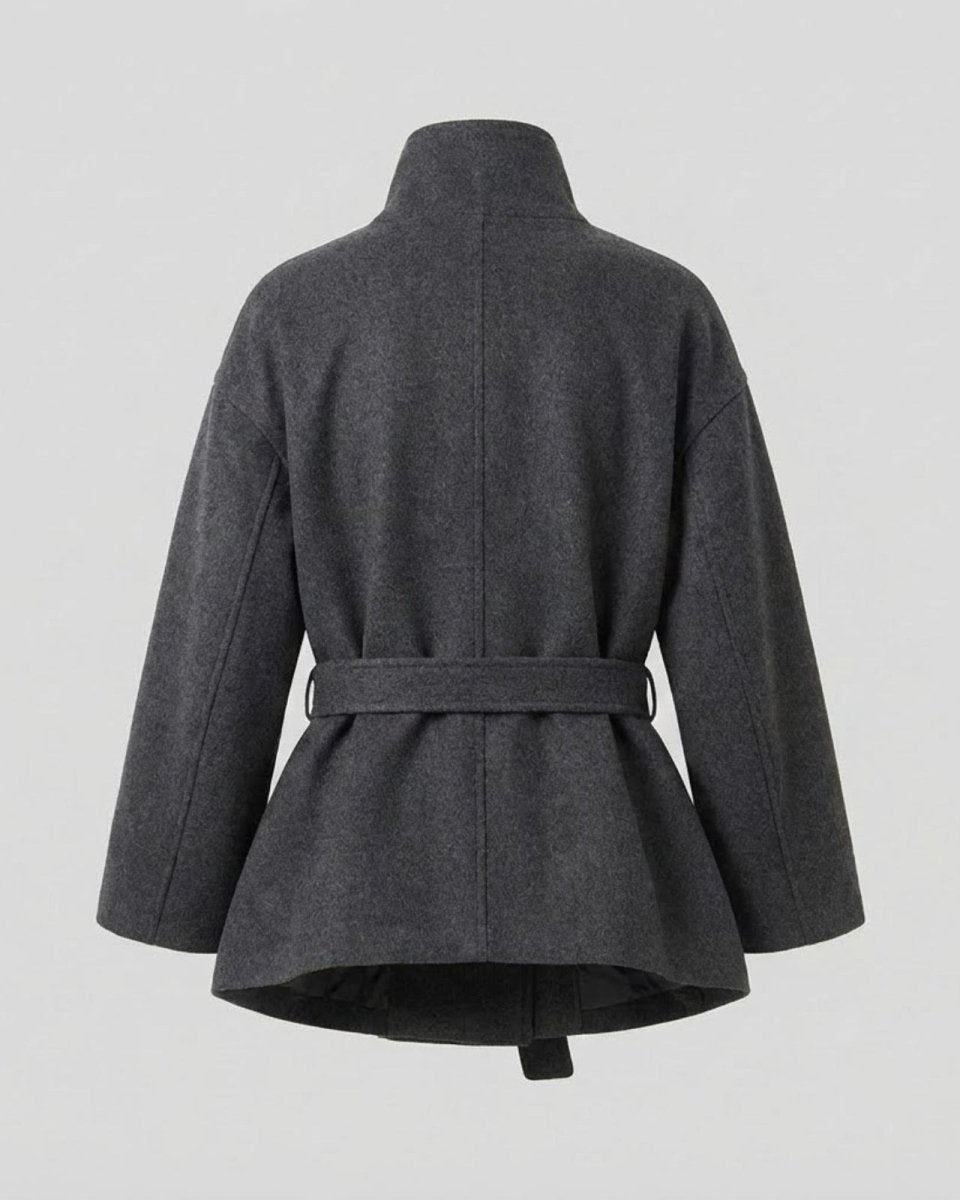 Back flat lay of the Verna short wool coat, displaying the construction and belt loop details.