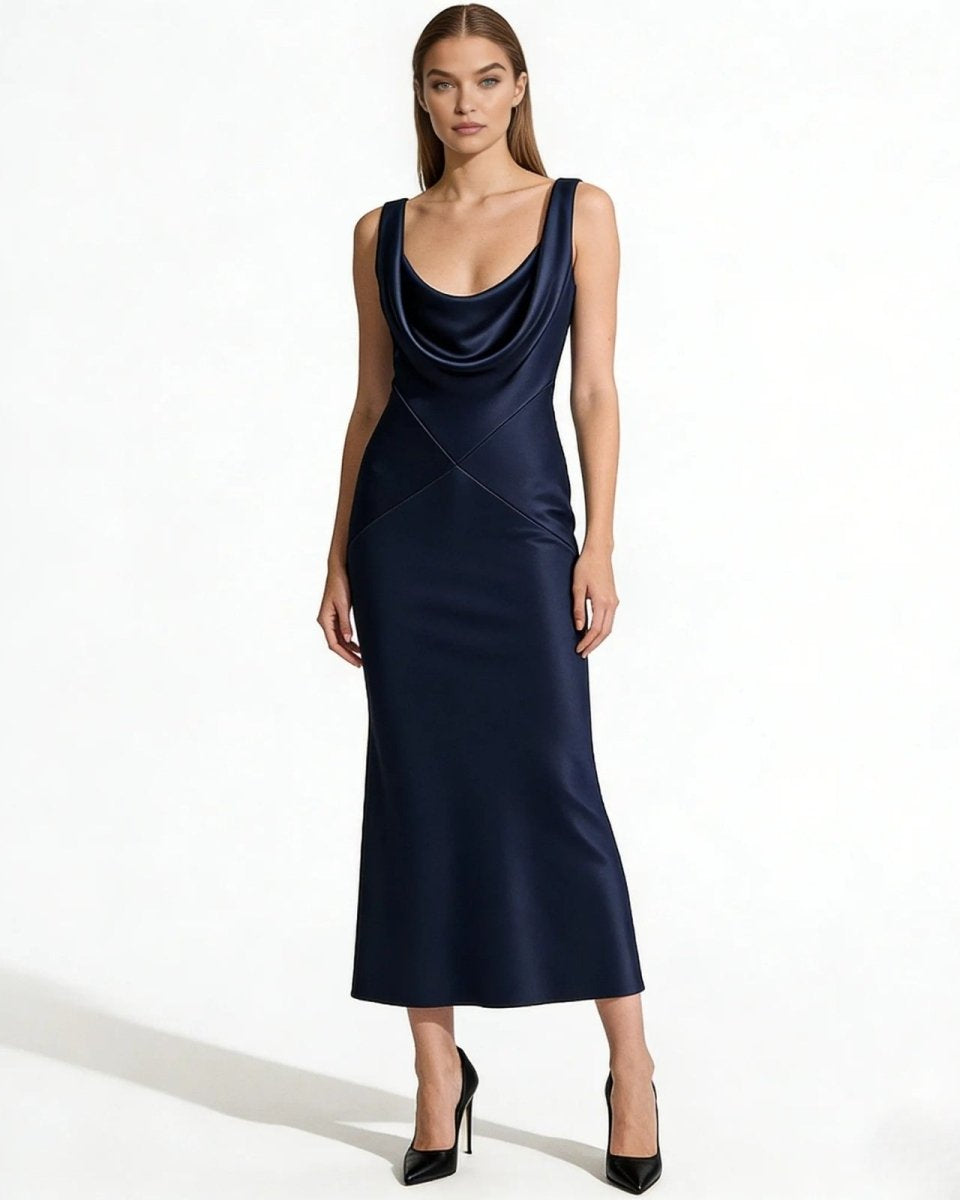 Model wearing the Vickie navy blue satin cowl neck maxi dress, showing the elegant draped neckline and full-length silhouette.