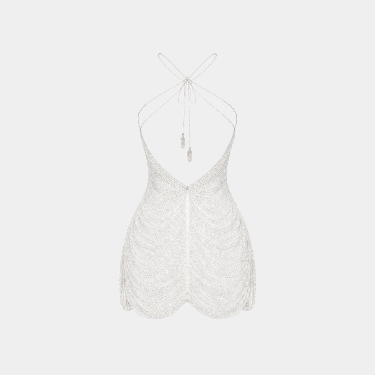 Flat product shot of the back of the Carey white beaded dress, showing the open-back design and tassel tie details.