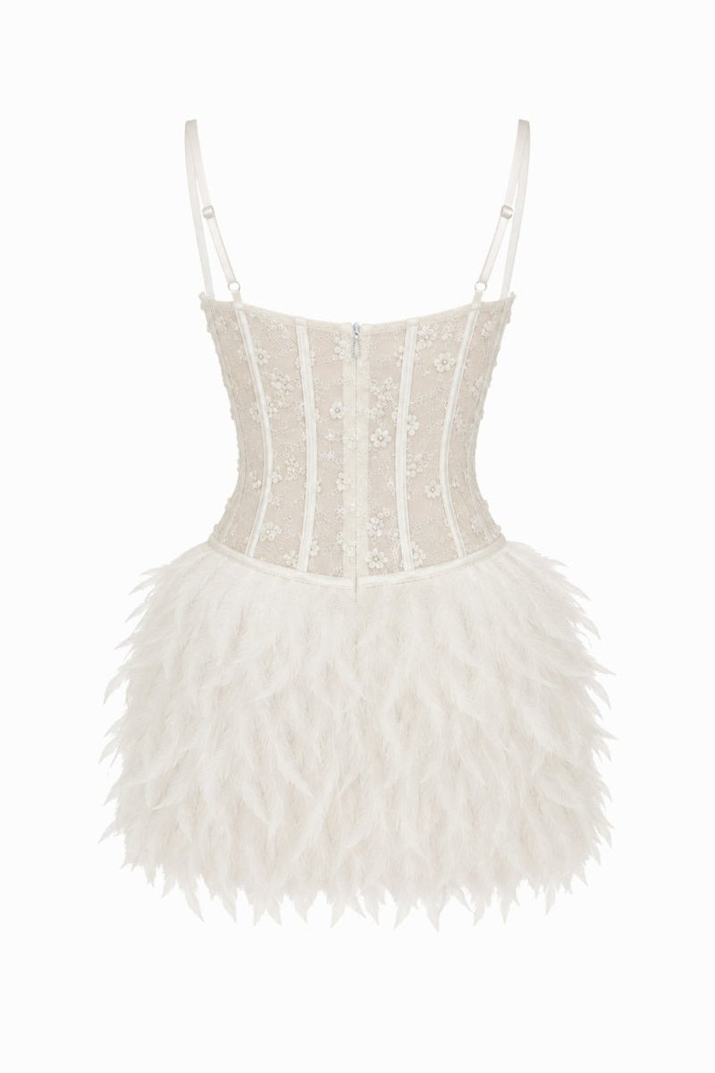 Flat lay back view of white statement evening dress showing corset back paneling and high-quality feather trim detail.