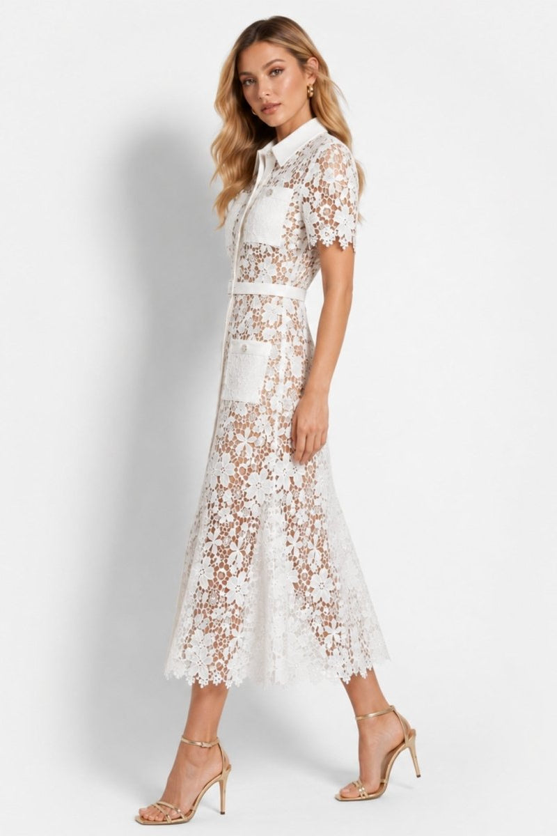 Side profile view of a white short sleeve lace midi dress with nude underlay and collared neckline, beautifully styled with gold strappy heels.