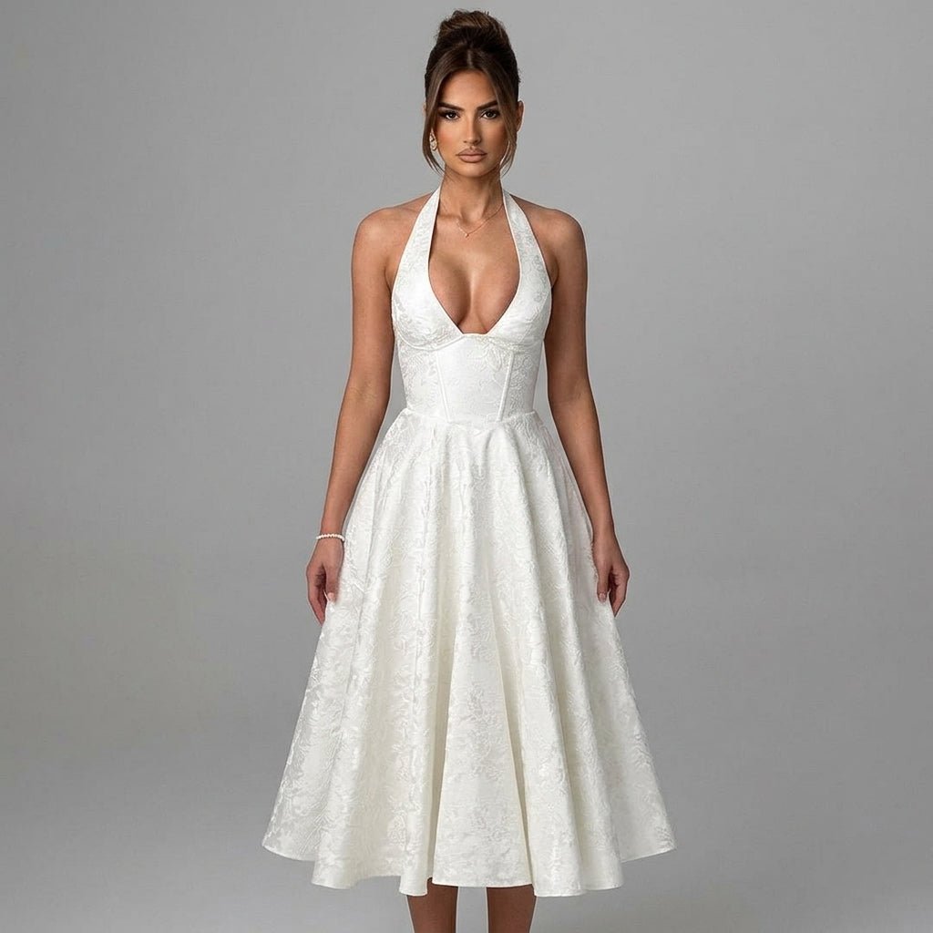 Angled modeling view of the Kouvr white engagement dress showcasing the full A-line midi skirt and sculpted boned bodice.
