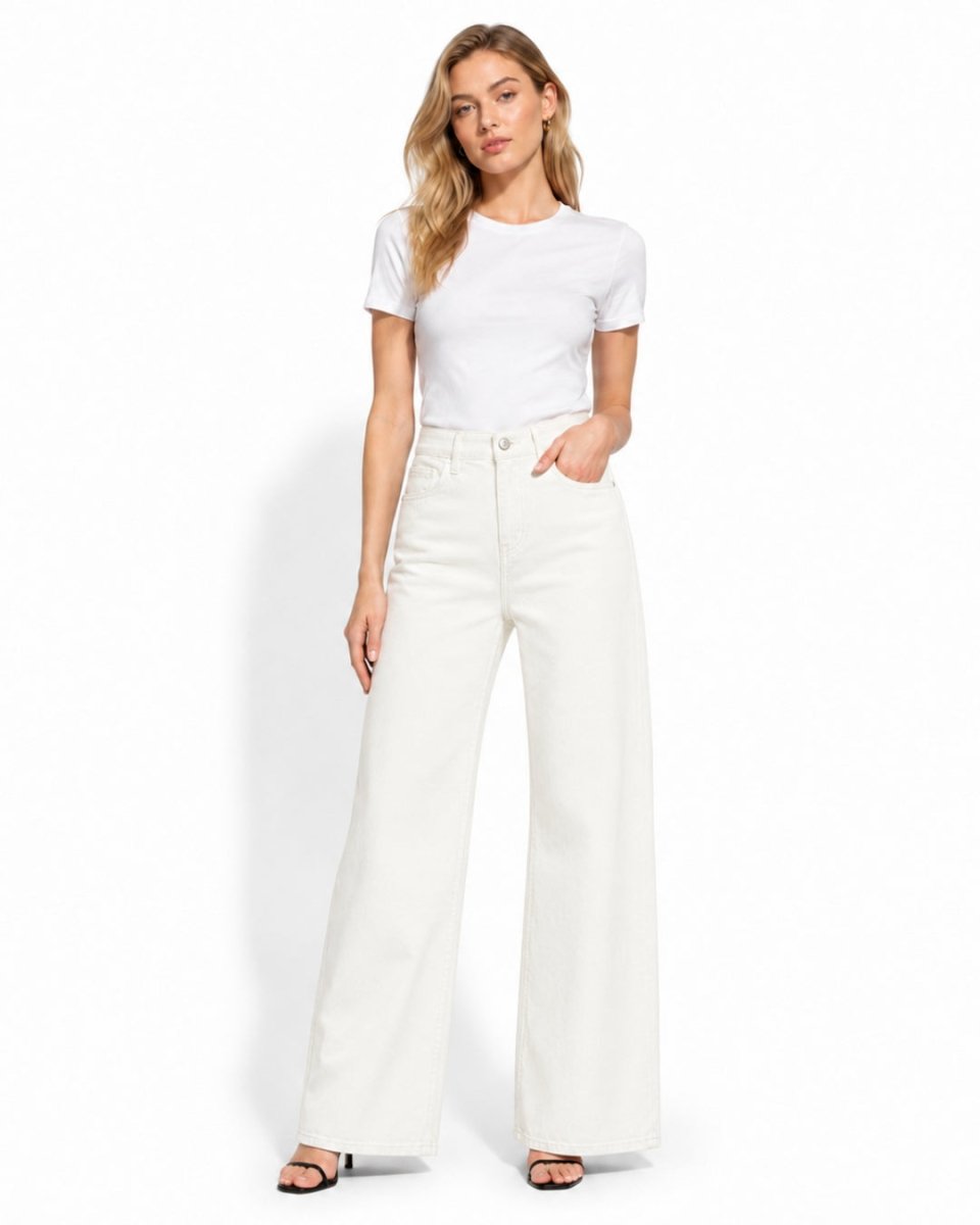 high waisted wide leg jeans in white front view styled with a basic white t-shirt and heels