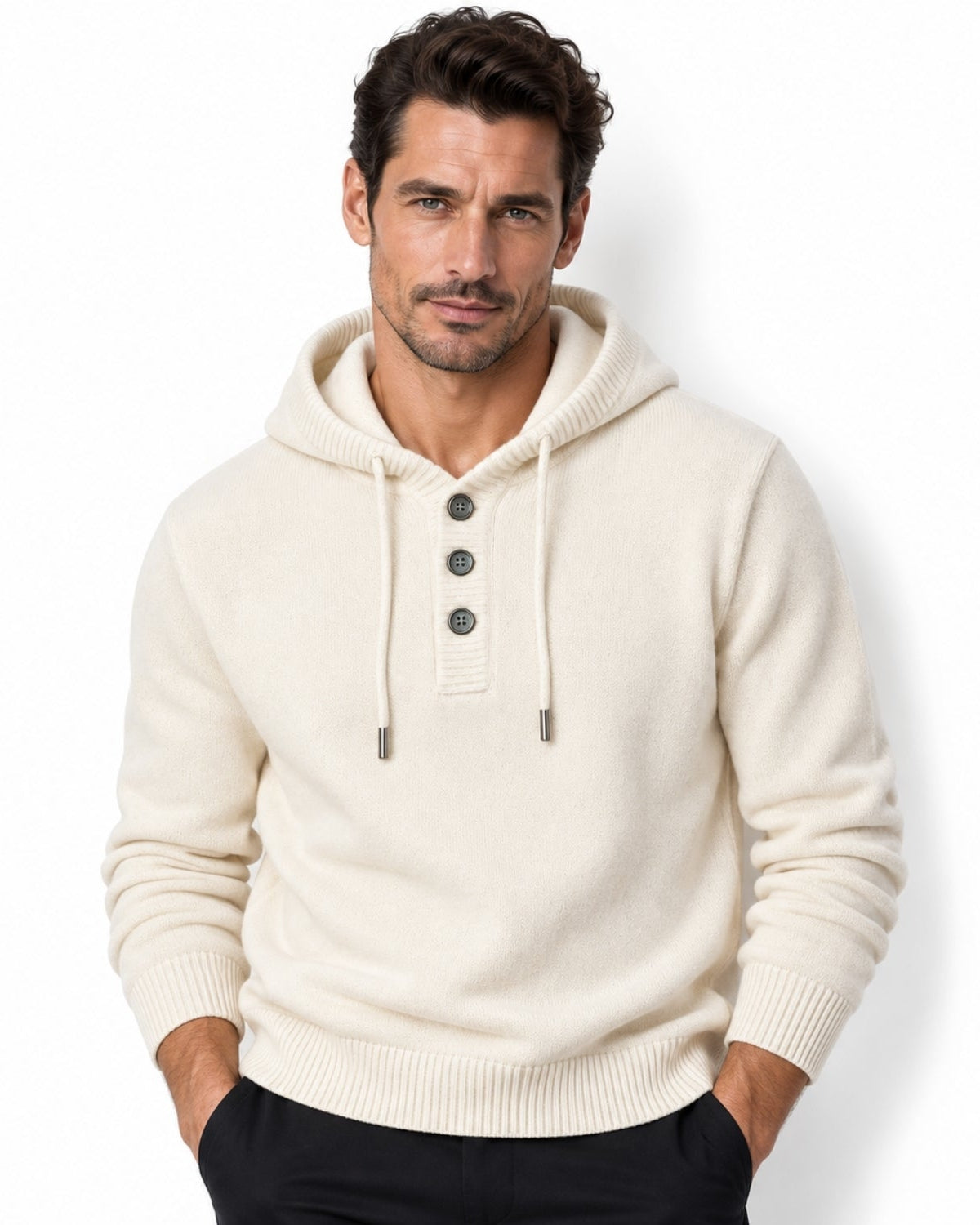 Front view of model wearing men's luxury knit hoodie in cream off-white with three-button placket.